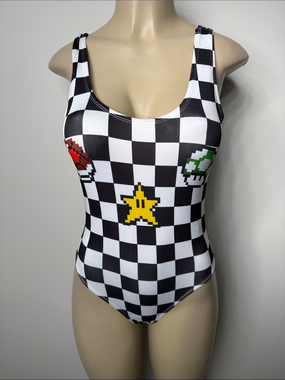 Forever 21 Black and White Checkered One-Piece Swimsuit with Yellow Star Accent